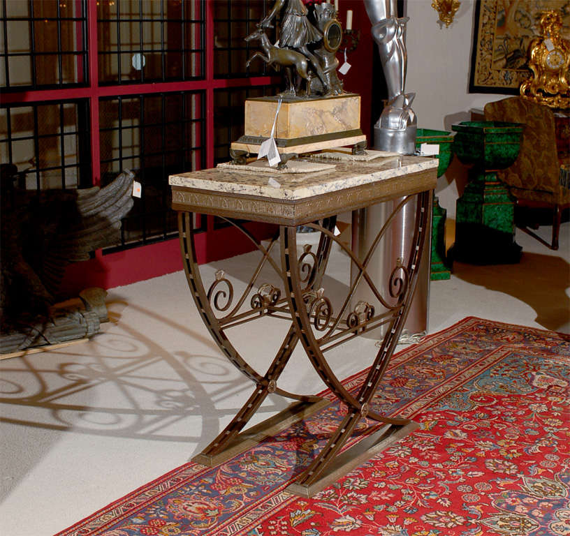 Superb Art Deco Iron Console, having Silver over Bronze Ornamentation and Granite Top. 
Dimensions: Height 41