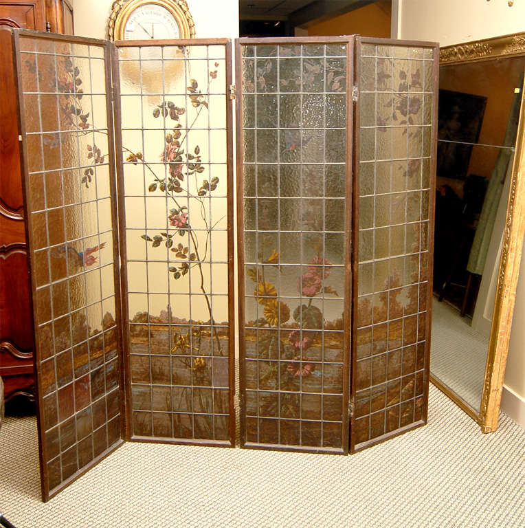 The  garden landscape is reverse painted on the smooth side of textured leaded glass. The four panel screen comes  from the Art Nouveau period. It is a mystical Jugendstil work that will make art a part of your everyday life.