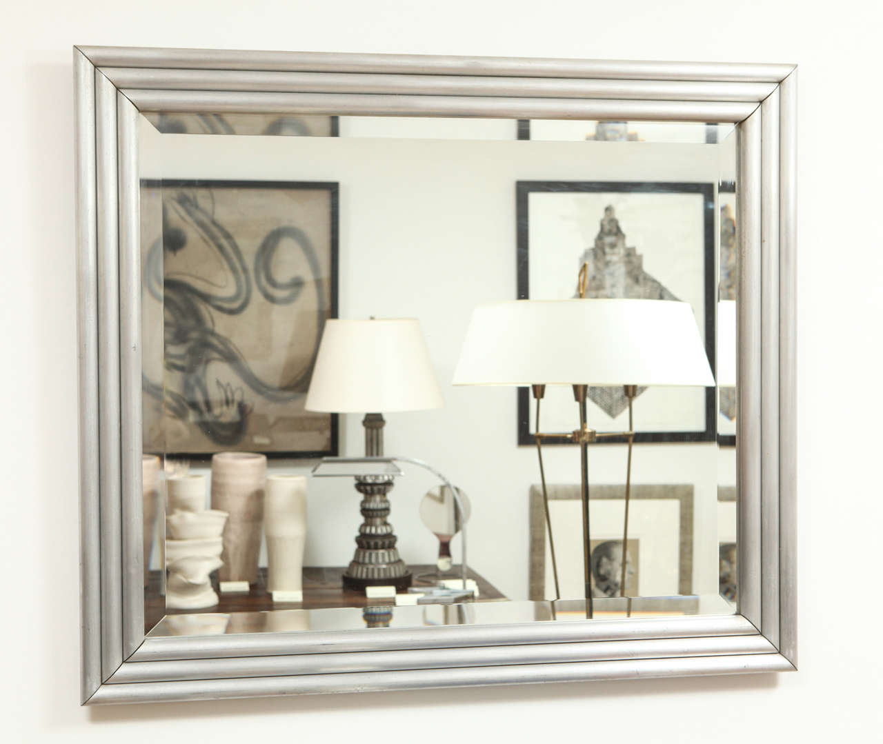 This mirror was made from hollow aluminum rods. New beveled mirror. Definitely a collector's piece. Note the back with handmade brackets.