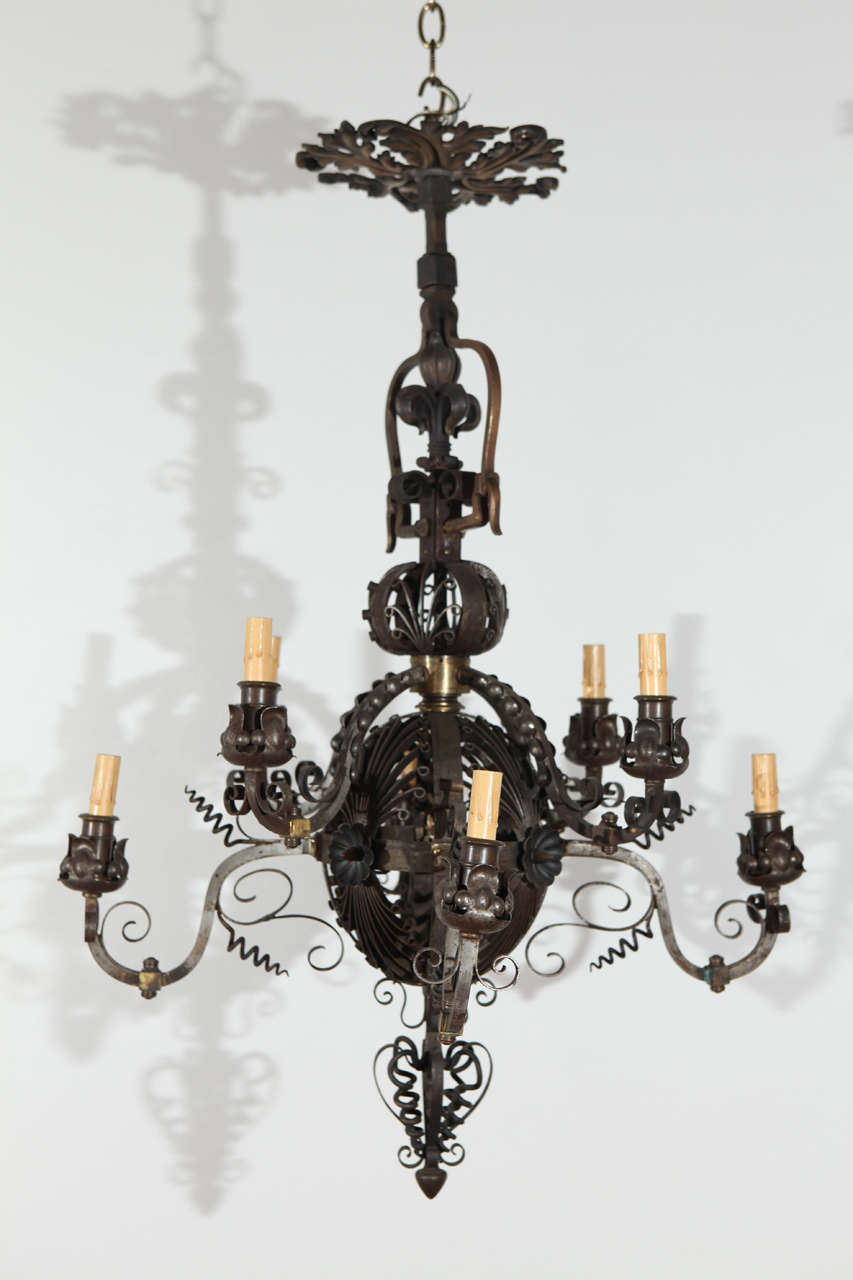 Very Fine five-arm cast iron chandelier with bronze details.  Signed 