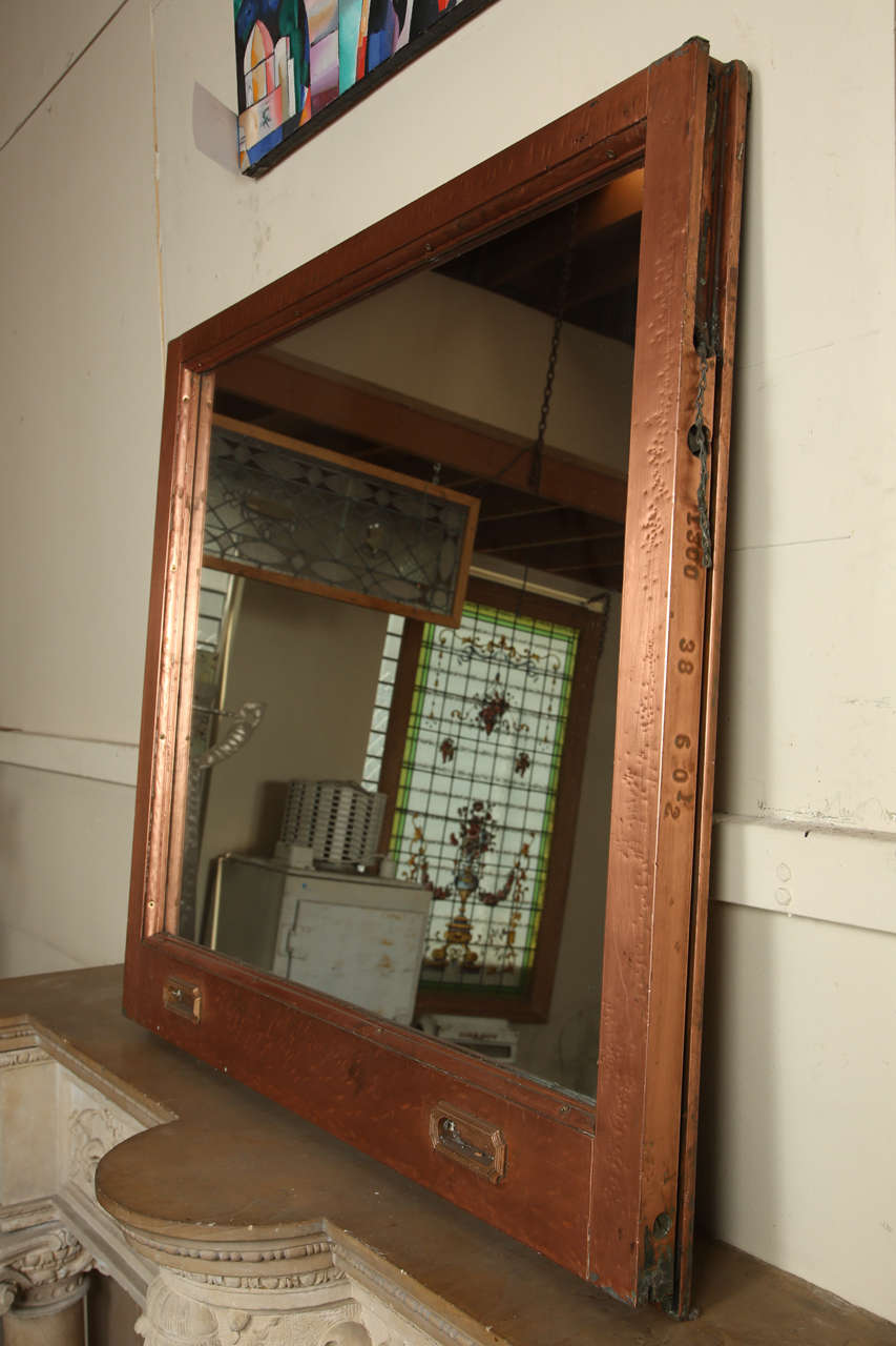Unique mirror made from salvaged copper window frames. The copper has been polished to a slight shine. This window came from the McAlpin Hotel in New York City which has recently undergone renovations. The McAlpin Hotel opened in 1912 on Herald