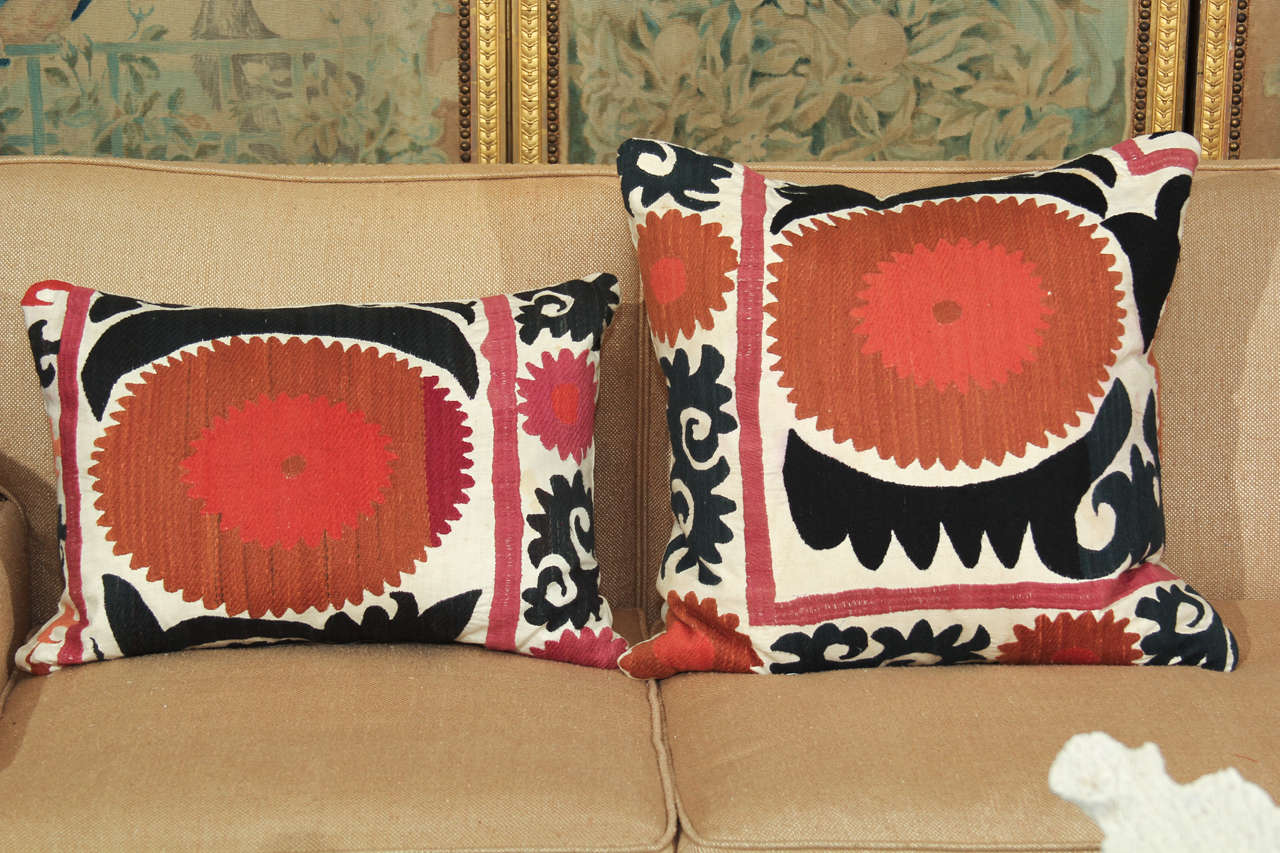 vintage suzani pillows  newly constructed with feather inserts and linen backs
priced at 1000.00 for the pair
can be sold individually as follows:
large square (20 x 20)  595.00
smaller rectangle  (15 x 20) 495.00