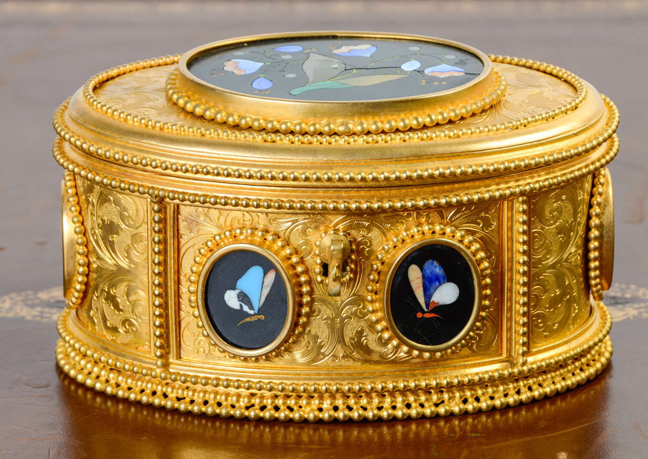 Gold-plated box with fine stone medallions.
signed TAHAN on the lock