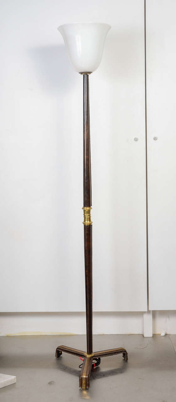 Stitched black leather floor lamp.