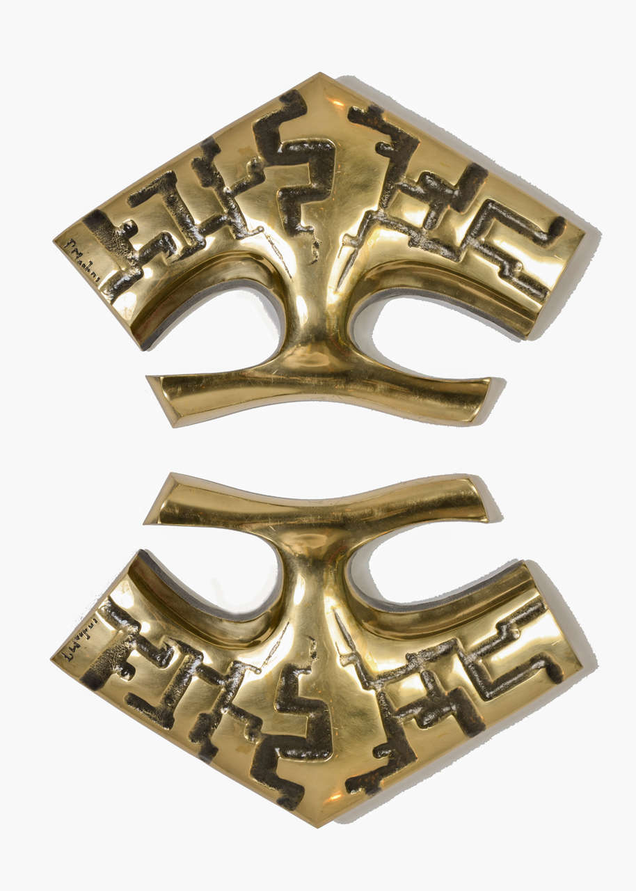 Pair of solid polished bronze sconces
signed by Peter Martens.