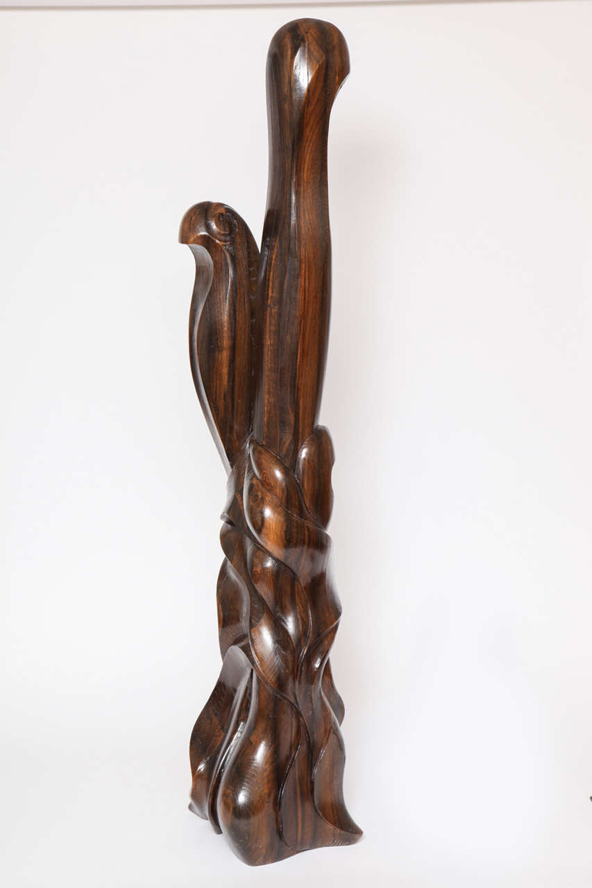 A highly stylized sculpture of a bird in a tree hand-carved walnut by the French artist, Marcel Buisson, circa 1950. Underside stamped.
Marcel Buisson with four circular stamps of a stylized person.