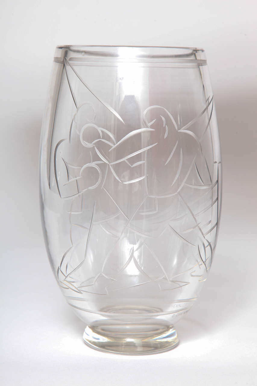 An Art Deco wheel cut glass vase depicting 