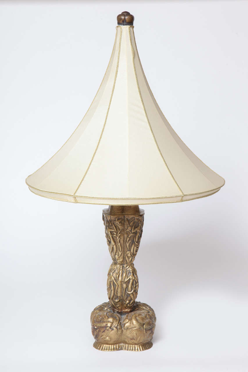 A hand hammered brass repousse table lamp designed by Karl Hagenauer,
In 1923 with stylized figures and floral motifs. Hammered with KH and 1923.
Mint condition. A unique example.