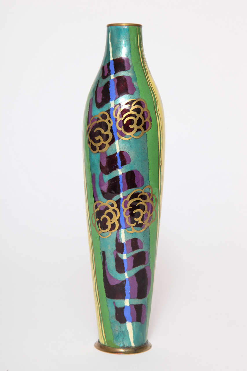 A French Art Deco enameled metal vase circa 1930 by Jules Sarlandie.
Multicolored abstract design.