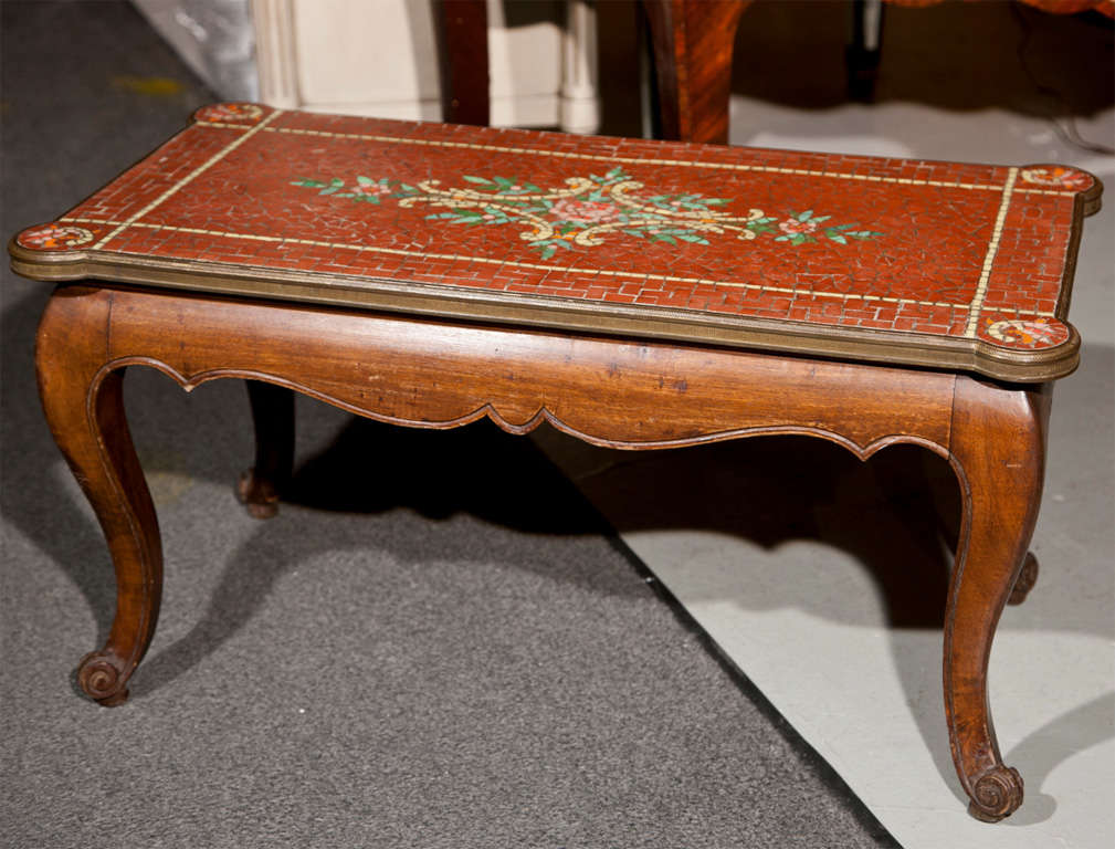 A fine tile micromosaic coffee table in the manner of Louis XV. Very decorative.