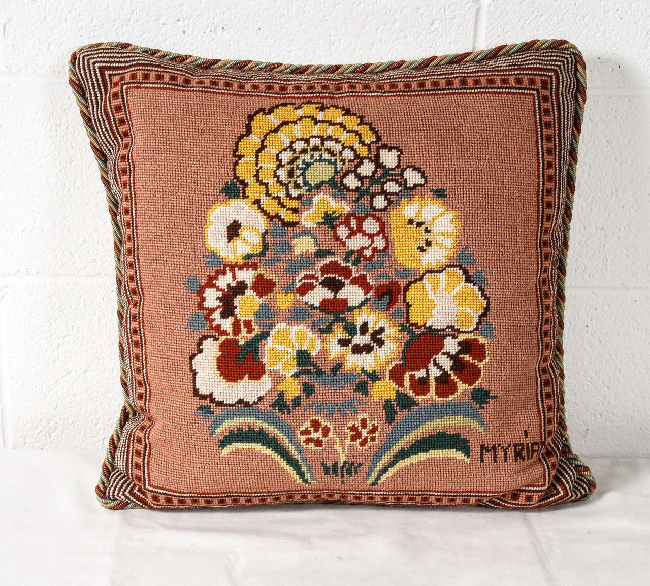 Here is a great vintage needlepoint pillow of a bouquet of flowers. The pillow has new cording and a linen back.