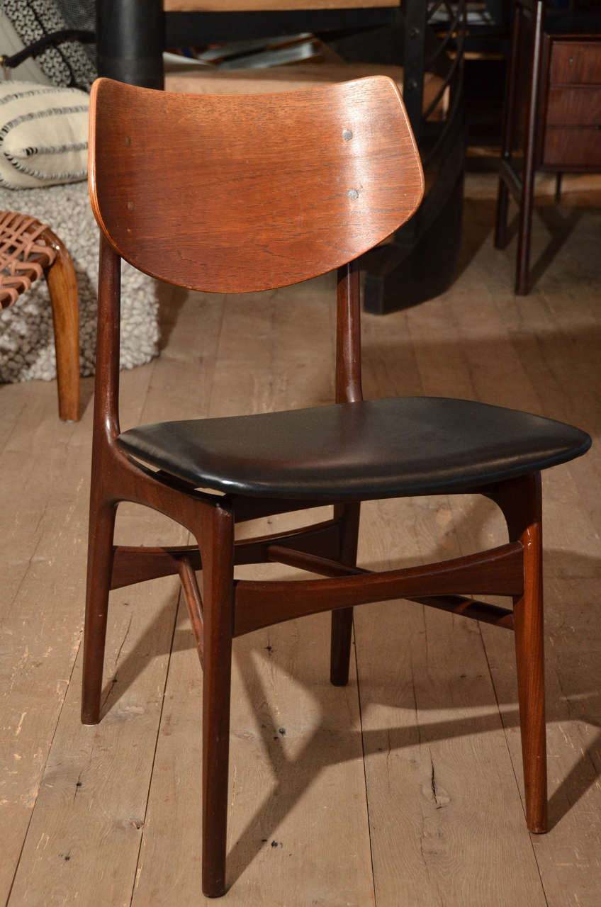 Beautiful set of four Scandinavian shield back chairs in walnut with newly re-upholstered leather seat.