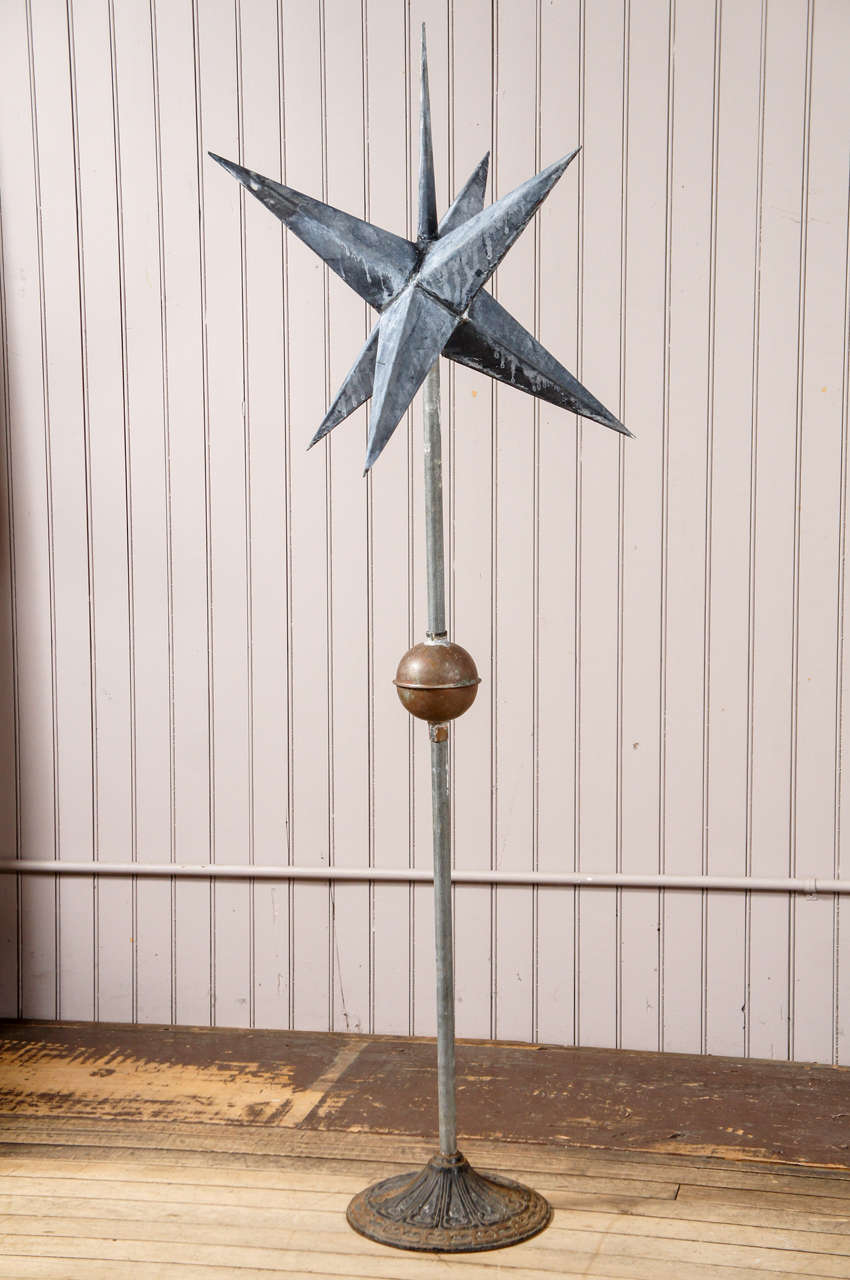 zinc moravian star - mounted on stand - cast iron base