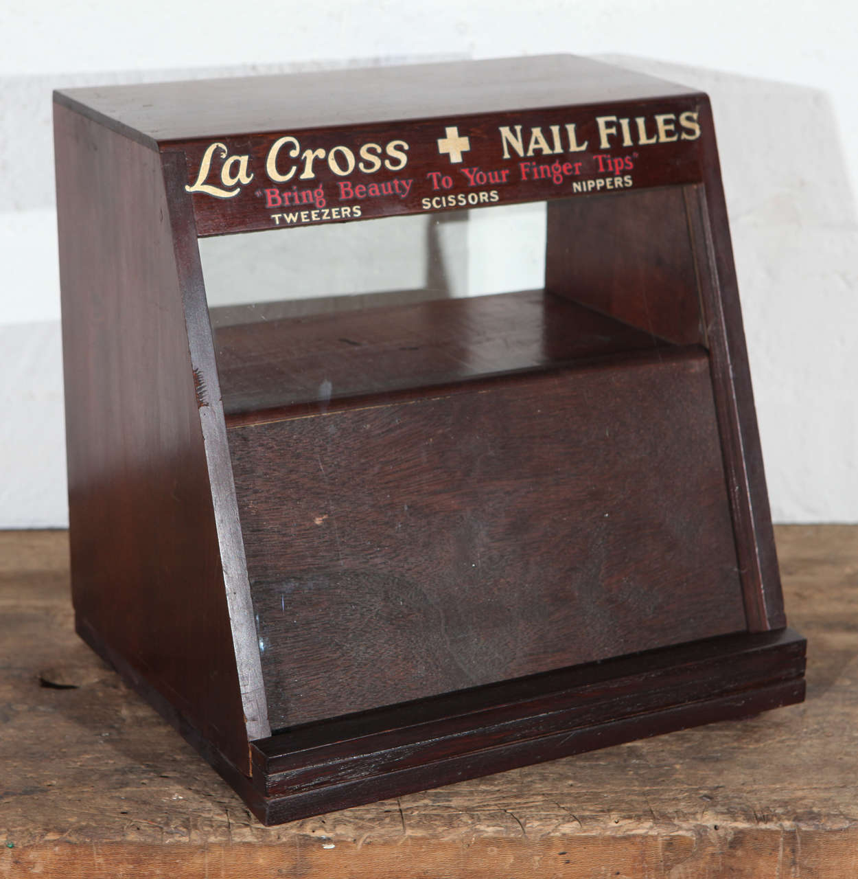 This is a great decorative item from a 1940s pharmacy or beauty store counter for display and storage of nail files and manicure items. The cabinet has two small drawers with metal knobs, paper labels and files for organization of supplies. The