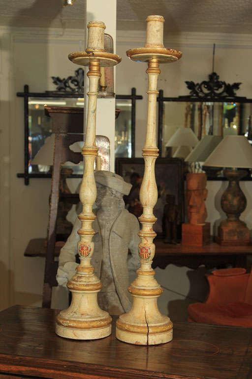 A Great Pair of very Tall Faux Marble Painted Candlesticks with Coats of Arms on the Base. Early 19th C.