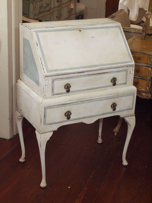 Antique painted, drop leaf petite secretary or desk with just the perfect patina.  Cabriole legs and original hardware.  Oyster white with pale blue accents and interior.  This desk was featured on the movie set of the soon-to-be released Twilight,