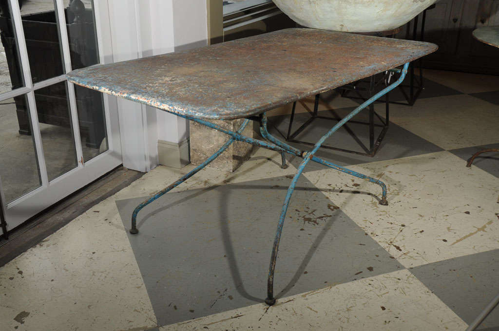Iron garden table c. 1900 table folds and has a nice blue paint