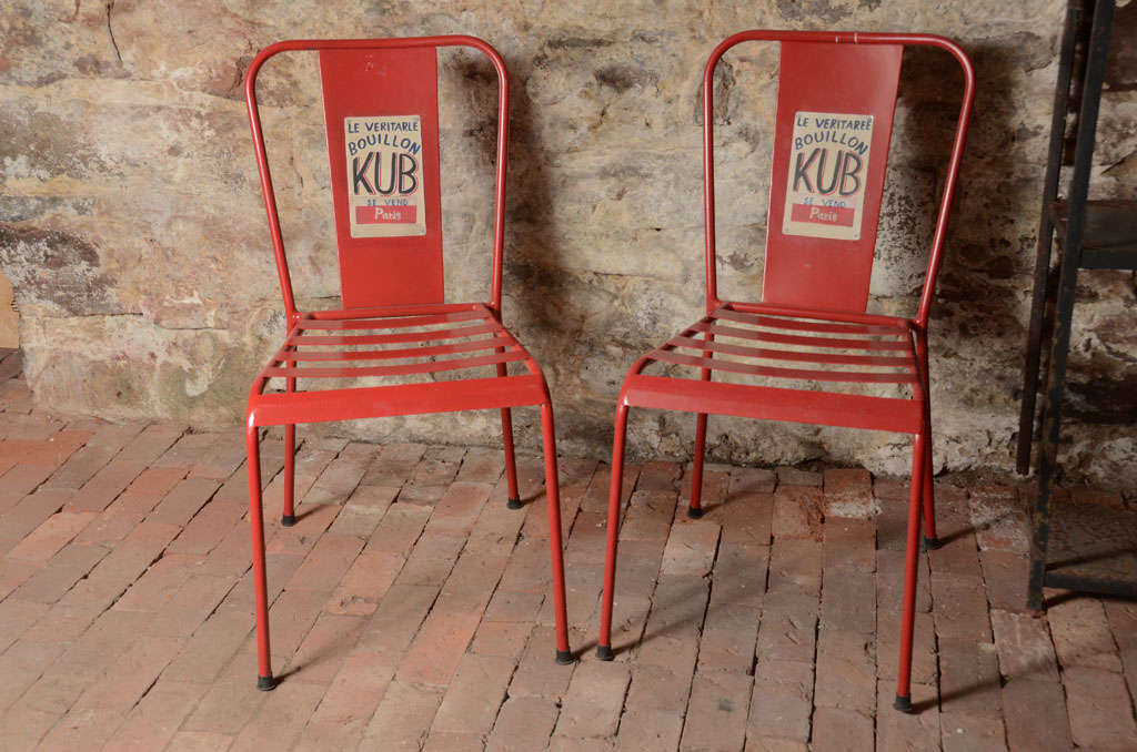 Fun Classic French Café Chair, based on pieces designed by Xavier Pauchard in 1934. These Red Metal French cafe style chairs have an advertisement on them. Amazing to have 10 of them!