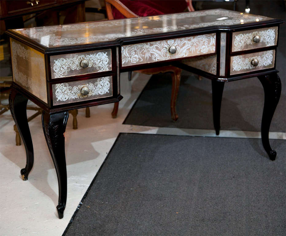 French Louis XVI style vanity, circa 1940s, dark-wood frame with beautiful verre eglomise glass veneer, silver-tone shell-form knobs, raised on cabriole legs.