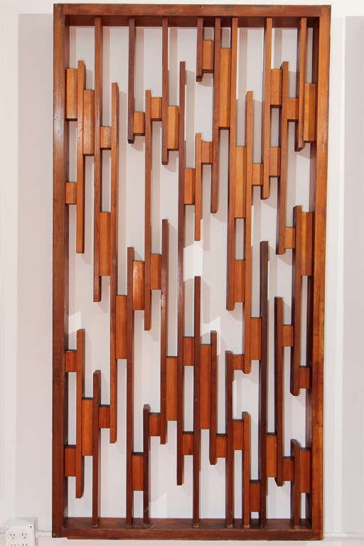 I believe the woods used to be fir and redwood.  These can hang as a chic installation or be hinged to create and incredible free standing floor screen.