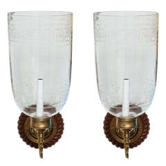 large etched glass globes with brass sconces/ wood backplates