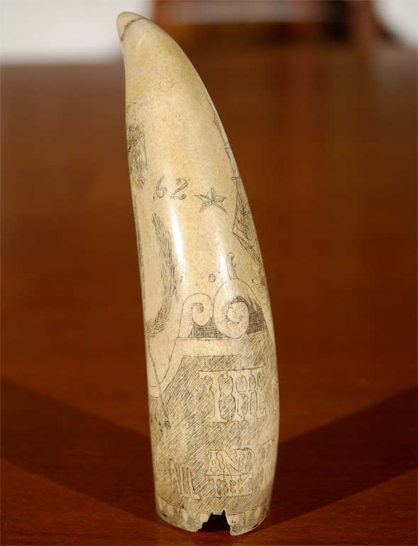 Offering an old whale's tooth with scrimshaw dated 1862. It seems to have a Civil War theme, has writing that says, 