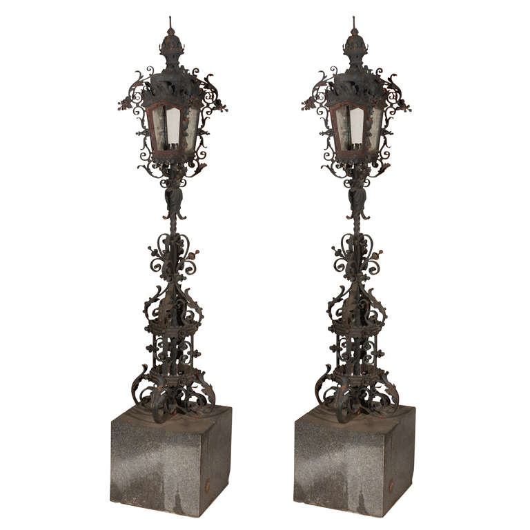 Pair Of Old Iron Torchieres On Marble Bases For Sale