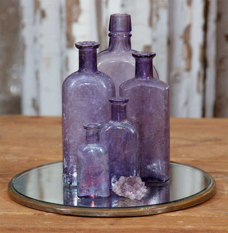 beautiful collection of 5 old purple bottles and nugget