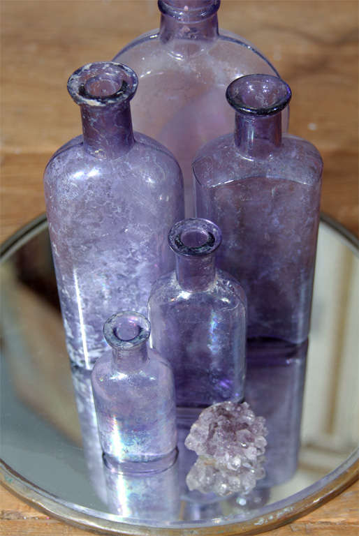 Glass purple bottles and amythest nugget