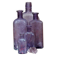 Antique purple bottles and amythest nugget