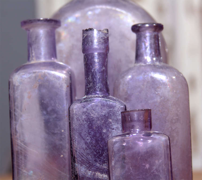 Glass group of 5 purple bottles