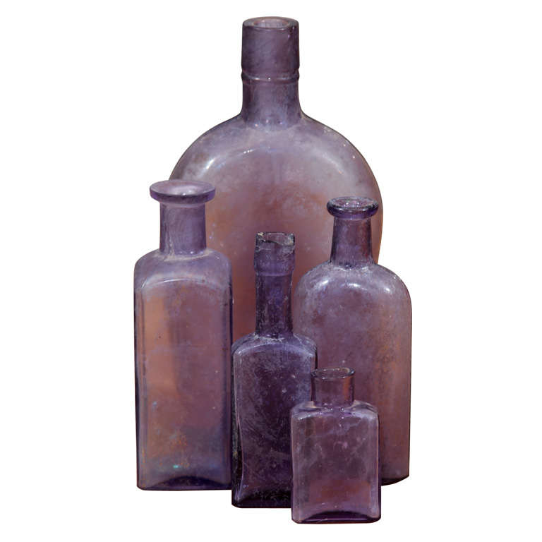 group of 5 purple bottles