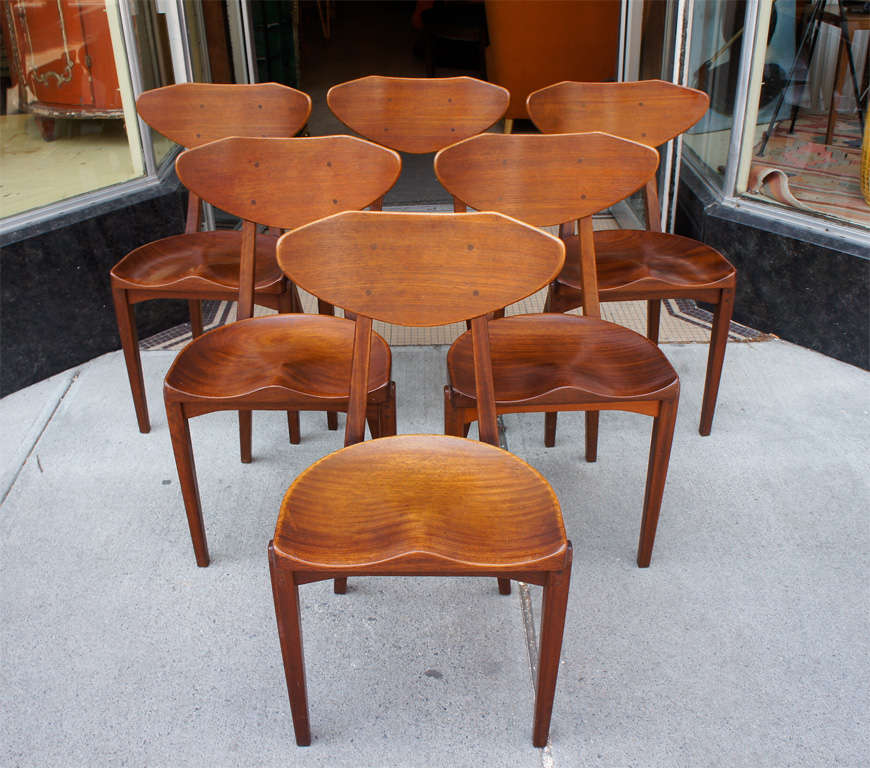 Rare set of 6 dining chairs by Danish furniture designers Kjaerulf Rasmussen and Richard Jensen, handcrafted chairs with tractor seat and hand hold in back  in solid mahogany