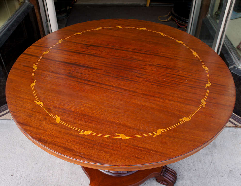 Mahogany center table with pedestal, quatreped base in mahogany with reeded column and scrolled feet, inlaid with satinwood