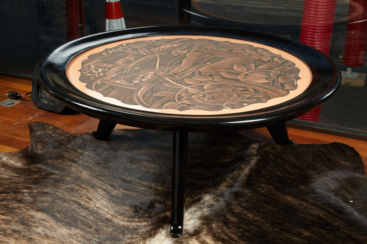 Low art deco table signed by Marx, painted and sculpted top, black lacquered basement