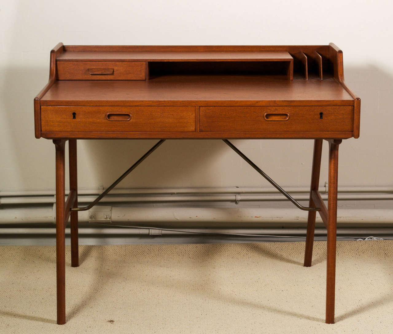 For your consideration is Danish Modern desk in teak by: Arne Iversen Wahl, for Vinde Mobelfabrik.  Designed in in 1961 this petite desk is perfectly scaled for city living.  It's small yet chic....It's sleek yet architectural in its stylings..... 