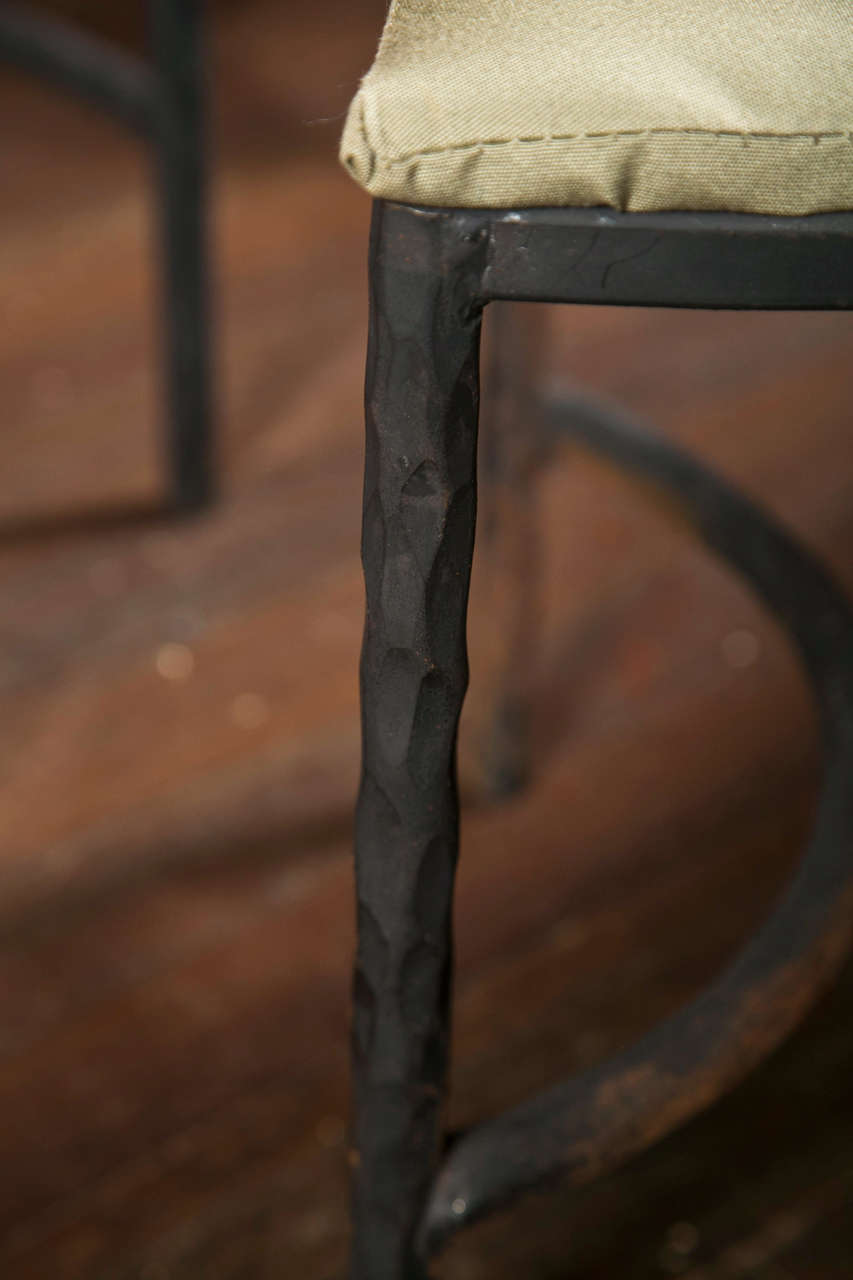Pair of handcrafted hammered wrought iron curved benches. Inside length (straight across) is 30.5