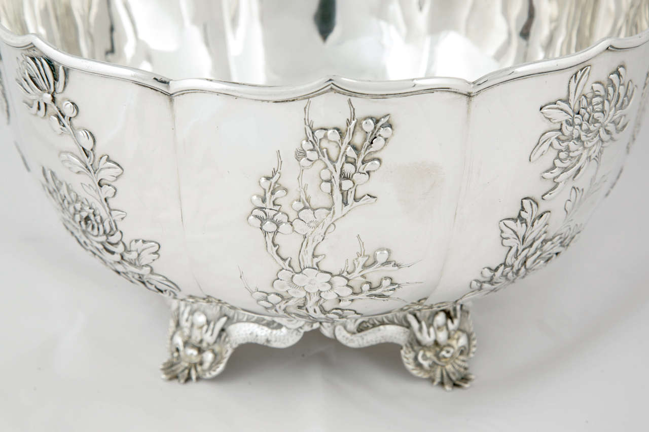 Round Chinese Silver Bowl, of segmented form, variously decorated with chrysanthemum, prunus, dragons and birds, all beautifully detailed. Retailed by the firm of Wang Hing '宏兴‘ which was the largest retailer in China between the 1860's and 1940's