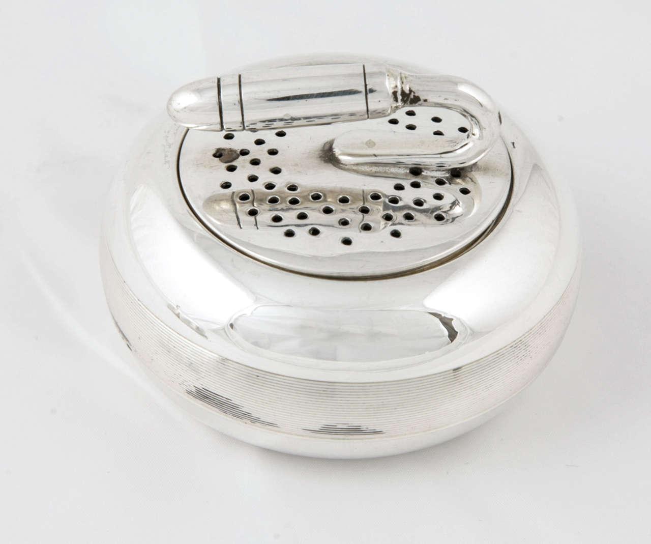 Of curling interest. A cased sterling silver condiment set, the mustard pot, salt cellar and pepper pot in the form of curling stones; and the salt spoon and mustard spoon are formed as 