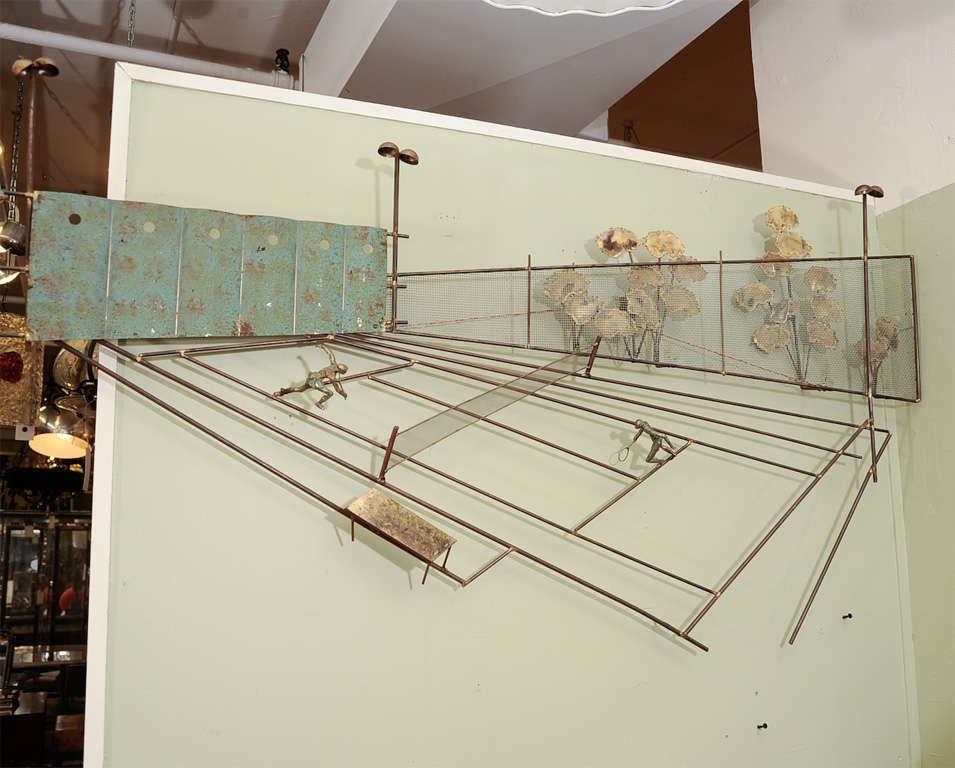 A mixed metal wall mounted sculpture by Curtis Jere, depicting a tennis game with cast bronze tennis players and a landscape of Brutalist trees in the background.<br />
Signed C. Jere