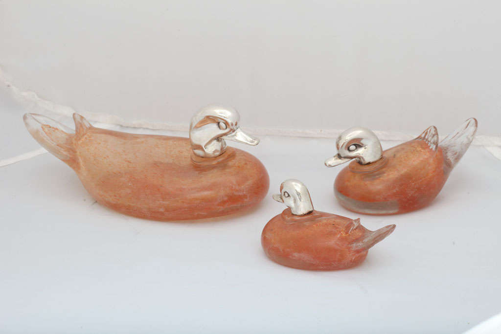 Unusual set of three, silver-mounted, probably Murano glass ducks, Italy, Ca. 1950's. The ducks measure as follows: The largest - @9