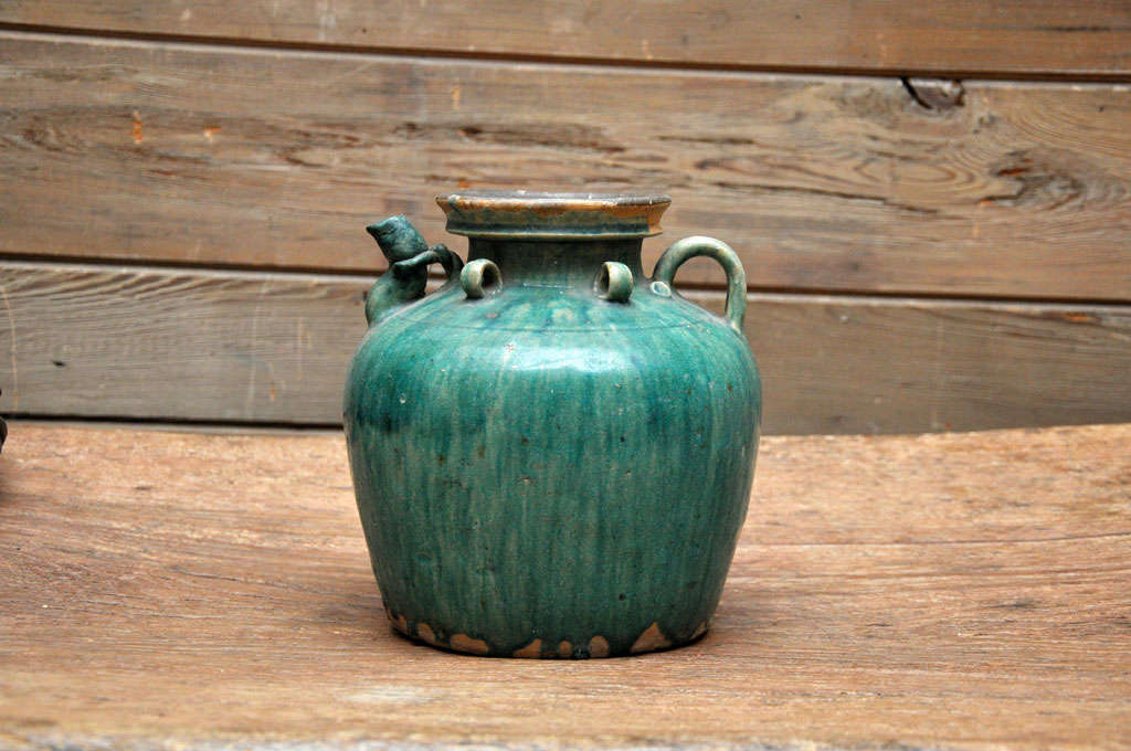 Green glazed tea pot from China's Qing Dynasty.  Probably used in a restaurant.