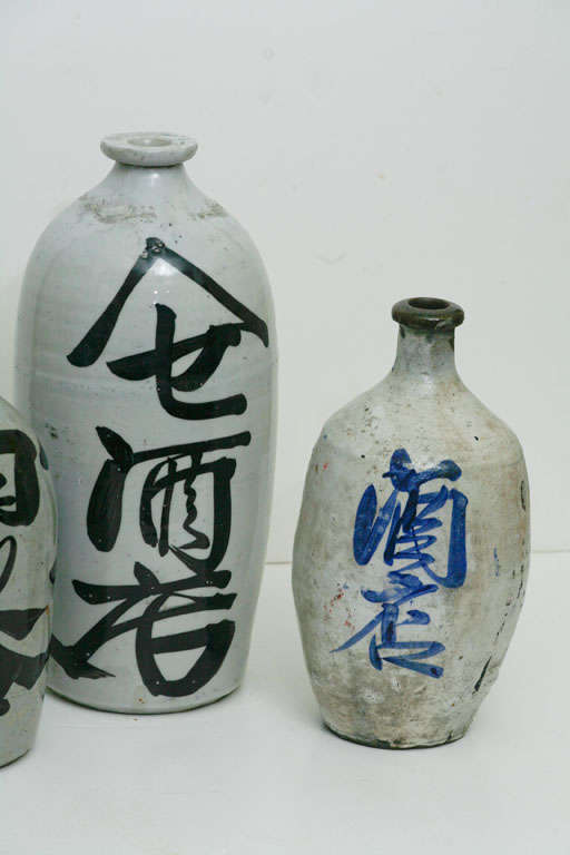 3 ceramic Japanese Sake bottles of varying age<br />
From right to left: 1940's, 1930's and 1900.