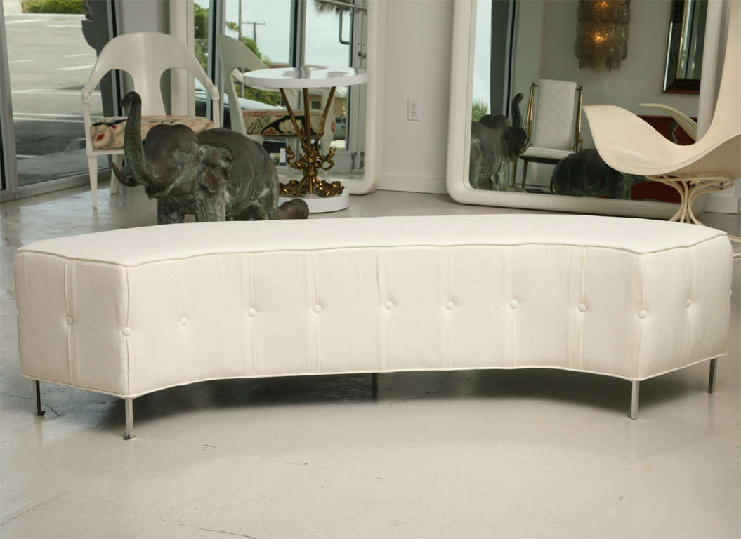 Pair of dramatic semi-circular upholstered benches with steel legs. Sold individually.