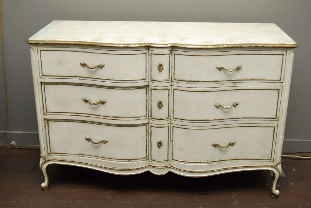 Louis XV Provincial style painted commode or chest of drawers with wonderful patina and details. Painted wood with trim detailed, decorative hardware.