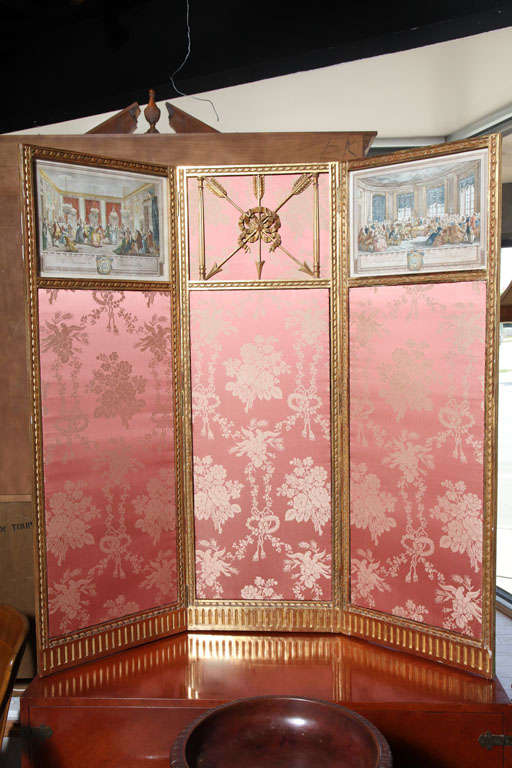 Elegant three-panel Empire screen with two steel engravings on the left and right panel with water gilded arrows on the centre panel. The bottom and back sides covered in a beautiful silk fabric with bouquets, garlands and birds. The entire screen