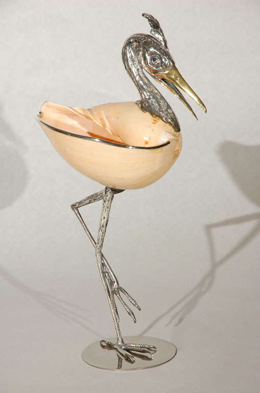 Featured is another beautiful Italian hand crafted seashell, silver plate and brass bird sculpture by Gabriella Binazzi.  This piece was created by integrating a large shell as its body. Signed Binazzi Firenze.