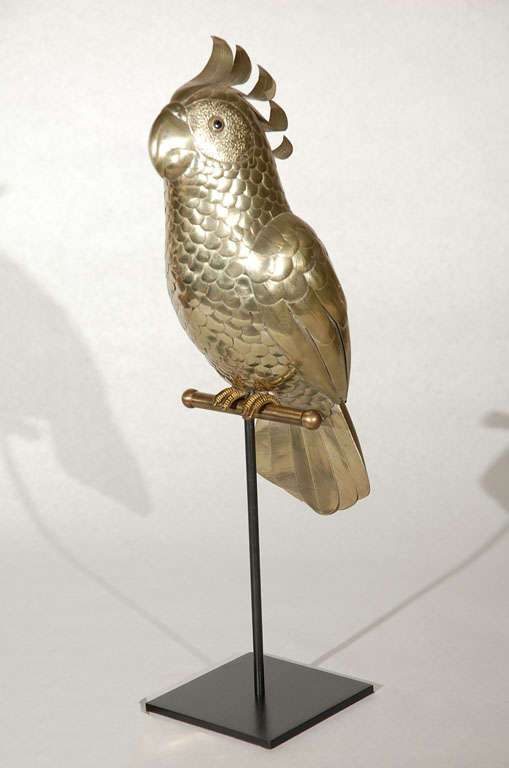 Charming hand cut and sculpted mixed metal cockatoo sculpture perched on a custom metal stand designed by Sergio Bustamante.  This piece is a real beauty with great proportions and craftsmanship.  Unsigned.