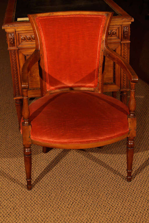 French Walnut Directoire Fauteuil 

This is a wonderful medium sized chair in the tradition of the 18th century fauteuils with the exposed wood on the open-arms. It has the old soft patina and was never lacquered.

It is solid walnut with some