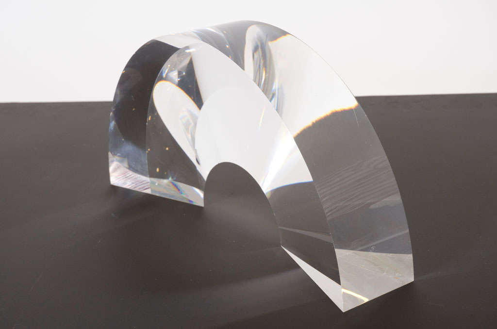A prismatic acrylic sculpture in the form of an arch that tapers inward creating a transformative three-dimensional effect. By Alessio Tasca, Italy, circa 1970.